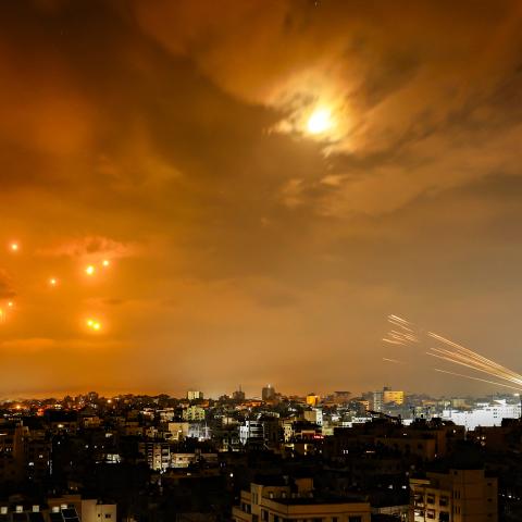 Rockets fired by Palestinian militants from Gaza City are intercepted by the Israeli Iron Dome missile defense system on October 8, 2023. (Eyad Baba/AFP via Getty Images)