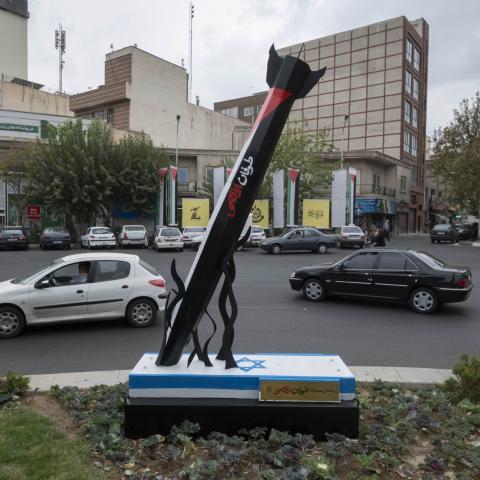 Vehicles drive past an anti-Israel urban artwork constructed and implemented by the municipality of Tehran, symbolizing Iran's support for the Palestinian Al-Aqsa storm missile attack on Israel, in downtown Tehran, October 12, 2023. (Photo by Morteza Nikoubazl/NurPhoto via Getty Images)