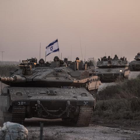 Israeli tanks move near Gaza border as Israeli army deploys military vehicles around the Gaza Strip, Israel, on October 12, 2023. (Mostafa Alkharouf/Anadolu via Getty Images)