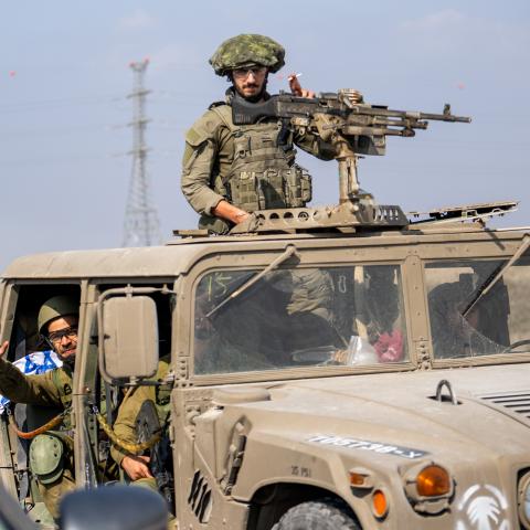 A convoy of Israel Defense Forces soldiers drives along a road near the outskirts of Netivot and near an Artillery position on October 11, 2023, in Netivot, Israel. (Alexi J. Rosenfeld via Getty Images)