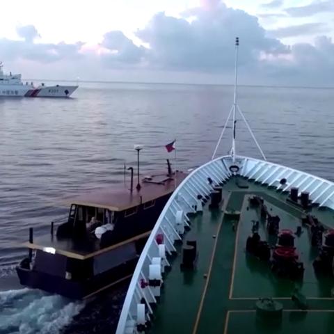 A Chinese Coast Guard vessel collides with a Philippine supply boat near the Second Thomas Shoal, part of the Philippines’ exclusive economic zone. (Screenshot of China Coast Guard video via Reuters)
