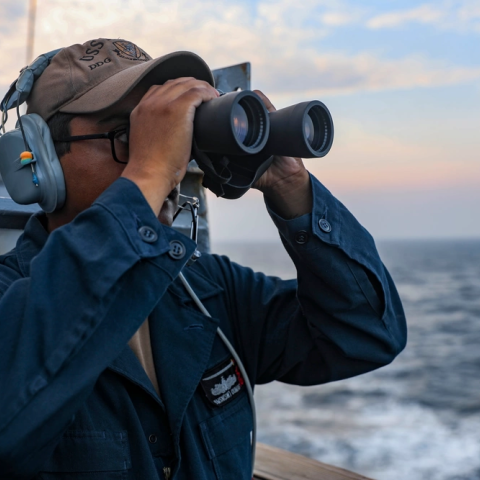 Seaman standing lookout watch on the bridge wing of the guided-missile destroyer USS Higgins (DDG 76) as the ship conducts routine Taiwan Strait transit. (Mass Communication Specialist 1st Class Donavan K. Patubo via DVIDS)