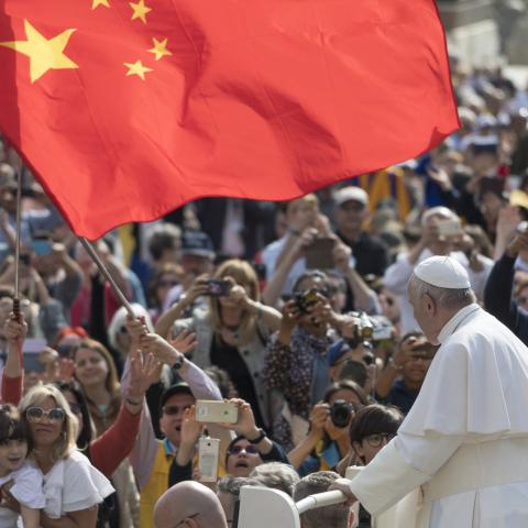 A group of pilgrim from China waves a red flag during the Pope Francis weekly general audience in St Peter Square at the Vatican, Wednesday, May 22, 2019. (Photo by Massimo Valicchia/NurPhoto via Getty Images)