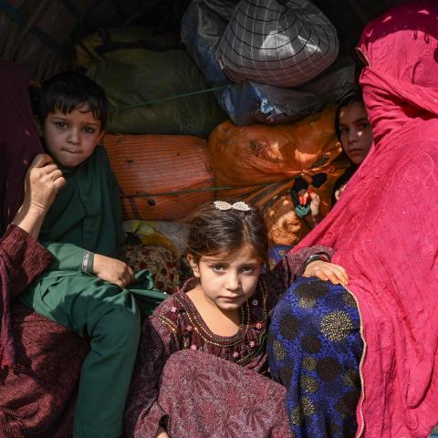 A family of Afghan nationals sit on a vehicle in Jamrud area of Khyber district on October 6, 2023. (Abdul Majeed/AFP via Getty Images)