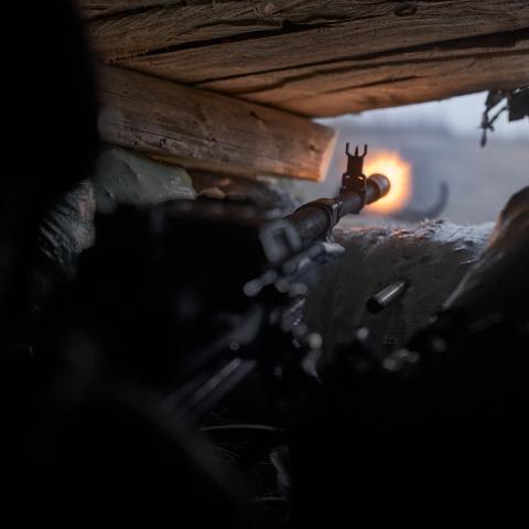Ukrainian soldiers open fire from a large-caliber machine gun to suppress enemy shelling on November 3, 2023, in Bakhmut, Ukraine. (Kostya Liberov/Libkos via Getty Images)