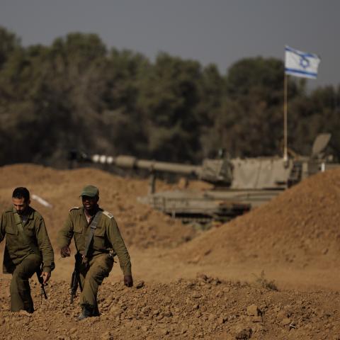  Soldiers from an Israeli artillery unit wait for orders to fire from the Israeli side of the border toward the Gaza Strip on November 6, 2023, in southern Israel. (Photo by Dan Kitwood/Getty Images)