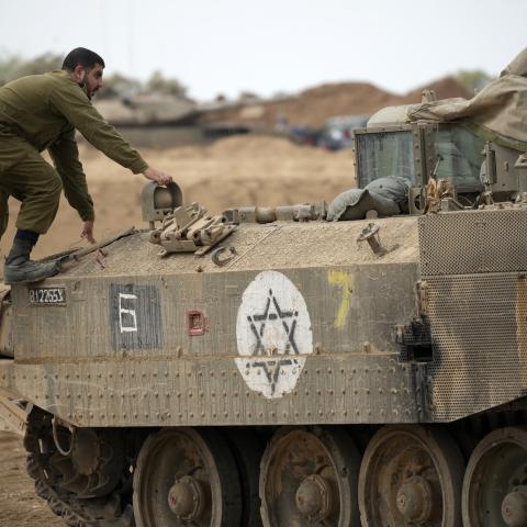 Israeli combat engineers maneuver their armored vehicles at a staging point near the Israeli border on November 14, 2023, near Sderot, Israel. (Christopher Furlong via Getty Images)