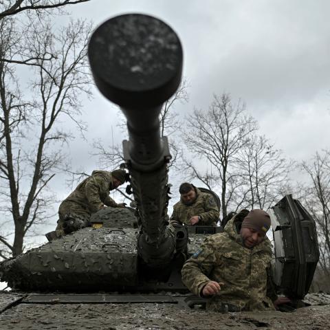 Ukrainian servicemen check their Sweden made CV90 armored infantry combat vehicle on a position pointing in the direction of Bakhmut in the Donetsk region on November 27, 2023. (Genya Savilov/AFP via Getty Images)