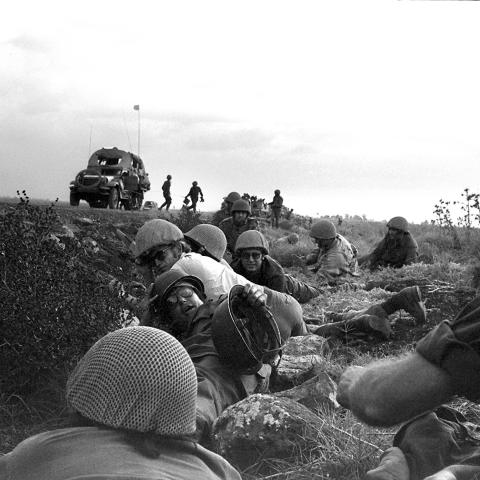 Israeli soldiers and journalists take cover from Syrian planes strafing the road on the Golan Heights during the 1973 Arab-Israeli War on October 8, 1973. (Ze'ev Spector/GPO/AFP via Getty Images)