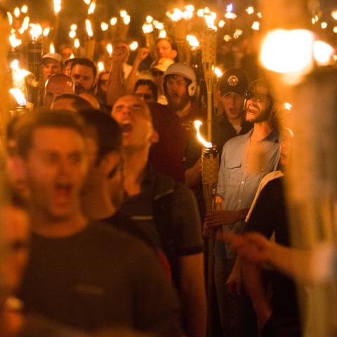 Neo Nazis, Alt-Right, and White Supremacists take part in a match the night before the "Unite the Right" rally in Charlottesville, Virginia. (Zach D Roberts/NurPhoto via Getty Images)
