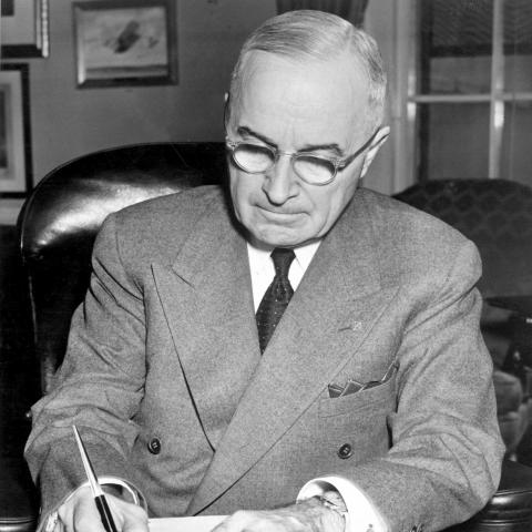 President Harry S. Truman at his desk at the White House signing a proclamation declaring a national emergency on December 16, 1950. (Morning Calm Weekly Newspaper via flickr) 