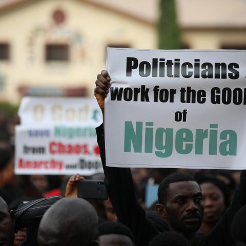 Christians hold signs as they march on the streets of Abuja during a prayer and penance for peace and security in Nigeria on March 1, 2020. (Kola Sulaimon/AFP via Getty Images)