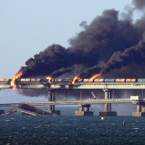 Black smoke billows from a fire on the Kerch bridge that links Crimea to Russia after a truck exploded near Kerch on October 8, 2022. (AFP via Getty Images)