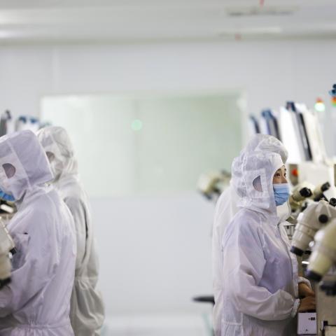 Workers at a production workshop of a chip manufacturing company in Suqian, China, on July 12, 2023. (Costfoto/NurPhoto via Getty Images)