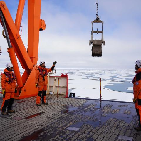 Members of China's thirteenth Arctic Ocean scientific expedition team conduct a sampling operation aboard China's polar icebreaker Xuelong 2 on August 6, 2023. (Wei Hongyi/Xinhua via Getty Images)