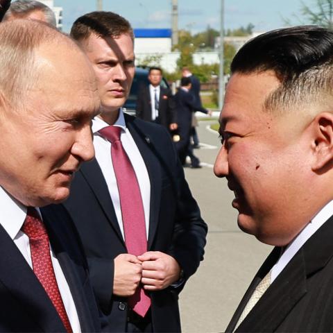 Russia's President Vladimir Putin shakes hands with North Korea's leader Kim Jong Un during their meeting in Amur Oblast, Russia, on September 13, 2023. (Vladimir Smirnov/POOL/AFP via Getty Images)