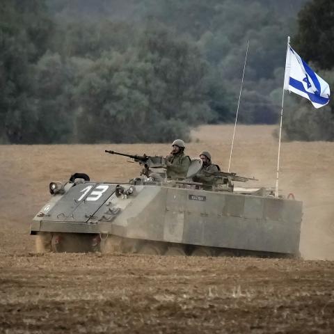 An Israeli armoured personnel carrier patrols near the border with Gaza on November 14, 2023, in Southern Israel. (Christopher Furlong via Getty Images)