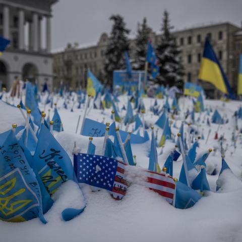 A makeshift memorial made of thousands of small flags with messages to those who have died in the war stands in the snow on December 8 2023, in Kyiv, Ukraine. (Ed Ram/For The Washington Post via Getty Images)