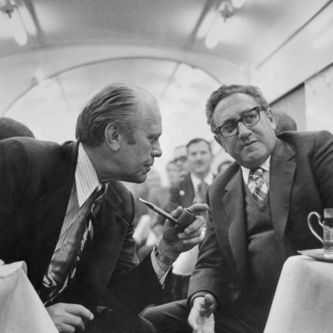 In the dining car on the train from Vladivostok to the airport on November 23, 1974, President Gerald Ford discusses progress on the SALT agreement with Secretary of State Henry Kissinger. (Bettmann via Getty Images)