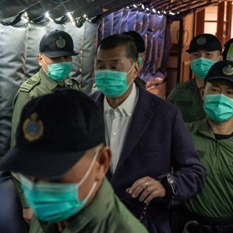 Hong Kong media tycoon Jimmy Lai founder and owner of Apple Daily newspaper is being escorted by Correctional Service Department officers to leave the Court of Final Appeal on December 31, 2020, in Hong Kong, China. (Anthony Kwan via Getty Images)
