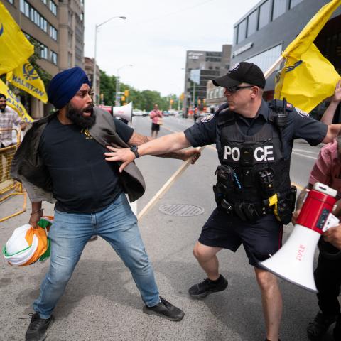 Sikhs protestors for the independence of Khalistan scuffle with police in front of the Indian Consulate in Toronto, Canada, on July 8, 2023. (Photo by Geoff Robins / AFP) (Photo by GEOFF ROBINS/AFP via Getty Images)