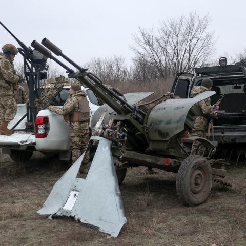 Air Defence Ukrainian servicemen, who took part in the defence operations during recent attacks on Kyiv, prepare their weapons near Kyiv on January 3, 2024, amid the Russian invasion of Ukraine. Deadly air strikes hit residential buildings in Ukraine on January 2, 2024, in an escalation of aerial attacks that killed five people and 130 wounded. (Photo by Anatolii STEPANOV / AFP) (Photo by ANATOLII STEPANOV/AFP via Getty Images)