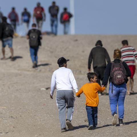Immigrants from Venezuela walk toward a US Border Patrol transit center after crossing the Rio Grande into the United States on January 8, 2024, in Eagle Pass, Texas. (John Moore via Getty Images)