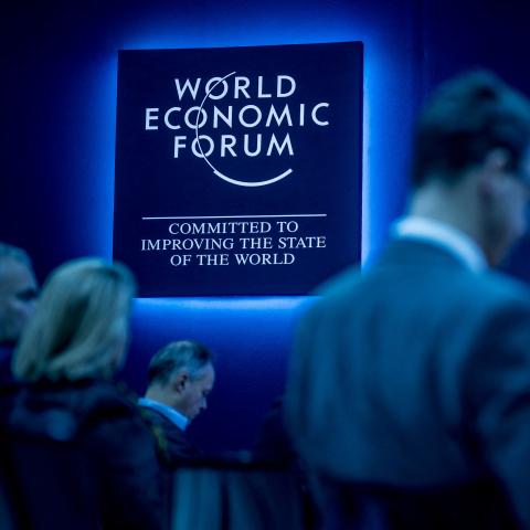 Participants wait for a session at the World Economic Forum annual meeting in Davos, Switzerland, on January 16, 2024. (Photo by Fabrice Coffrini/AFP via Getty Images)