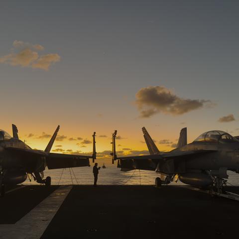 The Arleigh Burke-class guided-missile destroyer USS Daniel Inouye sails behind the Nimitz-class aircraft carrier USS Theodore Roosevelt on January 25, 2024. (Chris Williamson via DVIDS)