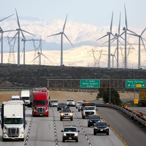 Wind turbines operate at a wind farm a key power source for the Coachella Valley as vehicles drive on February 22, 2023, near Whitewater, California. (Mario Tama via Getty Images)