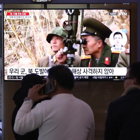 People watch a television screen showing a news broadcast with file footage of North Korea's artillery firing at a railway station on January 6, 2024, in Seoul, South Korea. (Chung Sung-Jun via Getty Images)