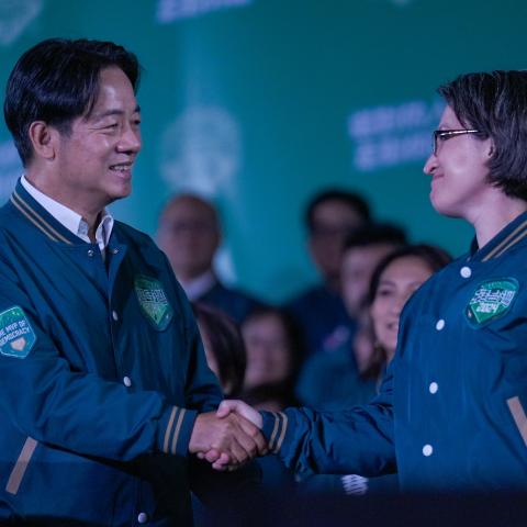 President-elect Lai Ching-te and Vice President–elect Bi-khim Hsiao shake hands during a rally for the presidential and legislative elections in Taipei, Taiwan, on January 13, 2024. (Walid Berrazeg via Getty Images)