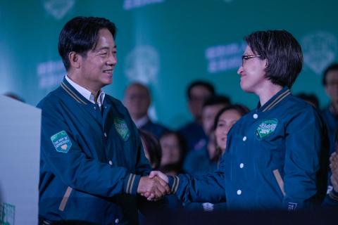 President-elect Lai Ching-te and Vice President–elect Bi-khim Hsiao shake hands during a rally for the presidential and legislative elections in Taipei, Taiwan, on January 13, 2024. (Walid Berrazeg via Getty Images)