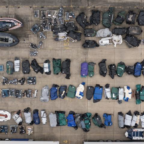 Boats and outboard motors assumed to have been used by migrants to cross the English Channel lie in a Border Force holding facility on January 17, 2024, in Dover, England. (Dan Kitwood via Getty Images)
