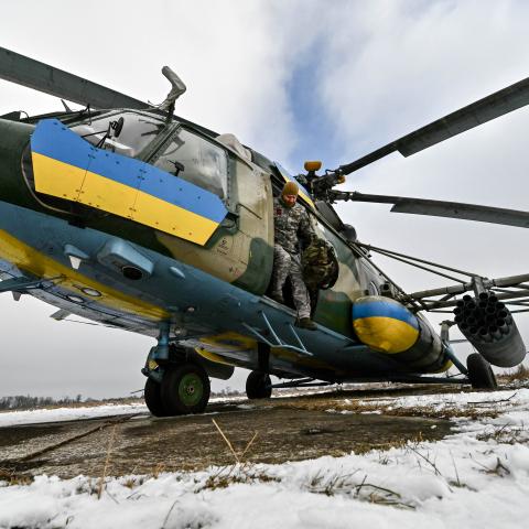  A serviceman of the 11th separate army aviation brigade "Kherson" of the Armed Forces of Ukraine is seen by a helicopter. (Photo credit should read Dmytro Smolienko / Ukrinform/Future Publishing via Getty Images)