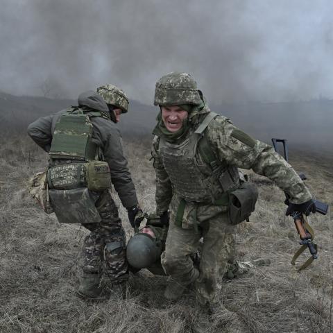 Ukrainian servicemen of the Skala battalion perform a medical evacuation during a field military exercise in the Donetsk region on February 3, 2024, amid the Russian invasion of Ukraine. (Photo by Genya SAVILOV / AFP) (Photo by GENYA SAVILOV/AFP via Getty Images)