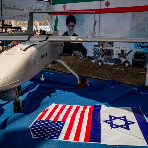 Missiles and UAVs are shown with Israeli and American flags in Tehran, Iran, on February 11, 2024. (Photo by Hossein Beris/Middle East Images/AFP via Getty Images)