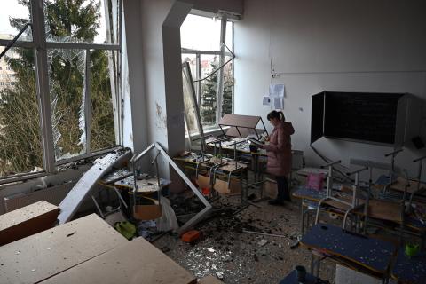 A school director inspects a classroom damaged as a result of a Russian missile attack in Lviv, Ukraine, on February 15, 2024. (Yuriy Dyachyn/AFP via Getty Images)