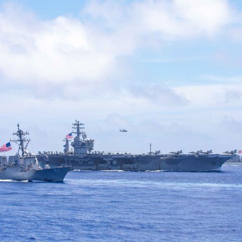 The Arleigh Burke-class guided missile destroyer USS Chung-Hoon (DDG 93), aircraft carrier USS Nimitz (CVN 68) and Arleigh Burke-class guided missile destroyer USS Wayne E. Meyer (DDG 108) sail in formation in the Philippine Sea, June 9, 2023. (U.S. Navy photo by Mass Communication Specialist 1st Class Ryre Arciaga)
