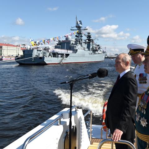 Russian President Vladimir Putin, accompanied by Defence Minister Sergei Shoigu and Commander-in-Chief of the Russian Navy, Admiral Nikolai Yevmenov, attending the Navy Day parade in Saint Petersburg on July 30, 2023. (Alexander Kazakov via Getty Images)