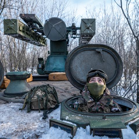 A Ukrainian soldier looks at the sky after hearing the sound of a nearby drone at the Bakhmut frontline in Donetsk Oblast, Ukraine, on January 13, 2024. (Photo by Ignacio Marin/Anadolu via Getty Images)