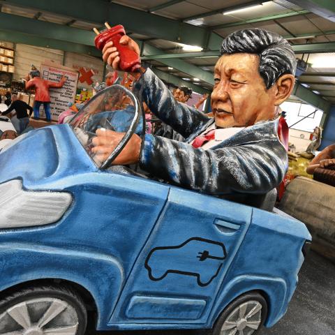 A model of Xi Jinping driving an electric car on February 6, 2024, in Mainz, Germany. (Photo by Arne Dedert/picture alliance via Getty Images)