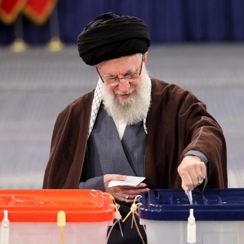Iran's supreme leader Ayatollah Ali Khamenei casts his ballot during the parliamentary and key clerical body elections at a polling station in Tehran on March 1, 2024.  (Photo by Atta KENARE / AFP) (Photo by ATTA KENARE/AFP via Getty Images)