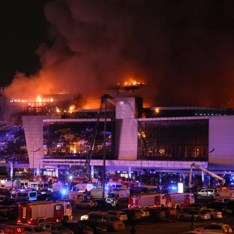 Emergency services vehicles are seen outside the burning Crocus City Hall in Krasnogorsk, Russia, on March 22, 2024. (Stringer via Getty Images)