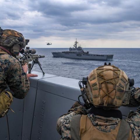 Sailors on the USS Green Bay participate in a visit, board, search and seizure (VBSS) drill with JS Osumi of the Japan Maritime Self-Defense Force (JMSDF) as part of Exercise Iron Fist near Japan on March 4, 2023. (US Navy photo by Mass Communication Specialist 2nd Class Matthew Cavenaile)