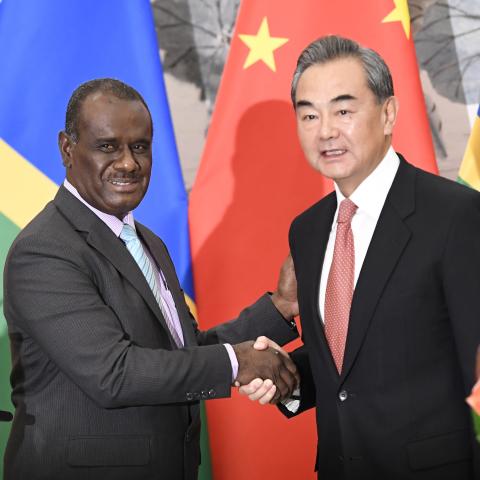 Solomon Islands Foreign Minister Jeremiah Manele shakes hands with Chinese Foreign Minister Wang Yi to mark the establishment of diplomatic ties between the two nations in September, 2019 in Beijing, China. (Naohiko Hatta via Getty Images)