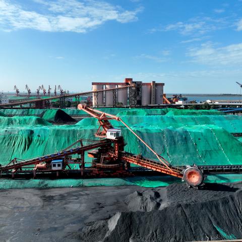 Machines load and unload coal at Lianyungang Port in Lianyungang City, China, on May 24, 2023. (Costfoto/NurPhoto via Getty Images)