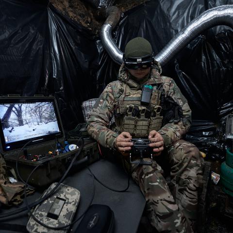 A soldier launches a kamikaze drone at Russian positions on January 26, 2024, in Kupiansk, Ukraine. (Photo by Kostiantyn Liberov/Libkos/Getty Images)