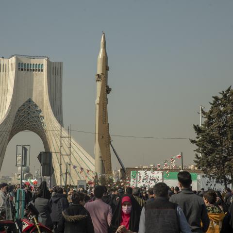 Iranians attend the annual rally commemorating the 1979 Islamic Revolution as domestically built missiles and a satellite carrier are displayed at the Azadi Square in in Tehran, Iran, on Sunday, February 11, 2024. (Photo by Majid Saeedi/Getty Images)