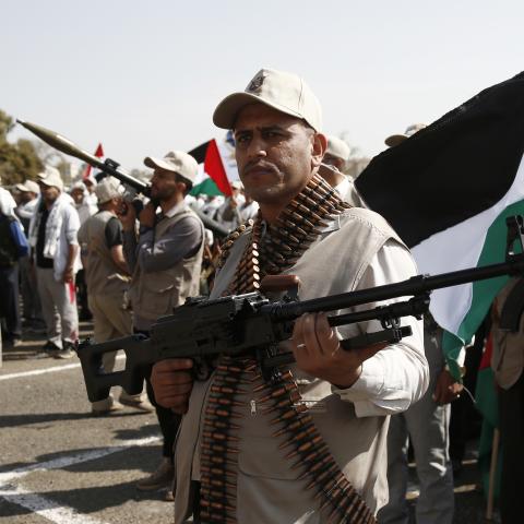 Houthi militants carry weapons at a rally against the US-led aerial attacks on Yemen on March 9, 2024, in Sana'a, Yemen. (Mohammed Hamoud via Getty Images)